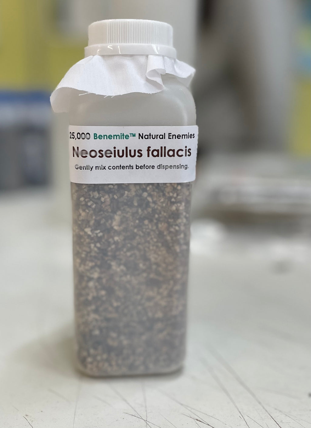 Bottle labeled 'Neoseiulus fallacis' with a white cap. 25k