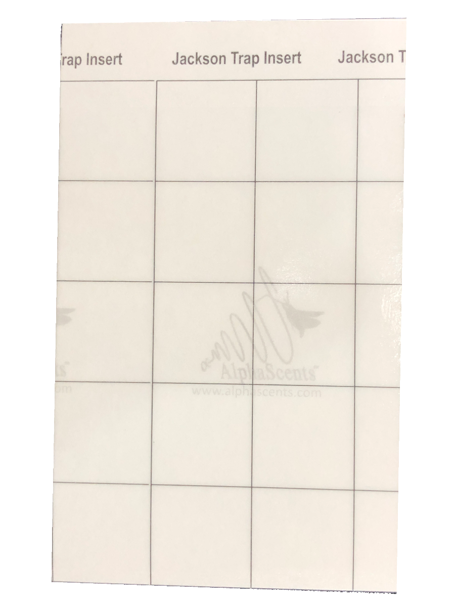 A white paper insert with a grid layout and printed text headers reading 'trap Insert', 'Jackson Trap Insert', and 'Jackson T', with a faint 'AlphaScents' watermark across the center.
